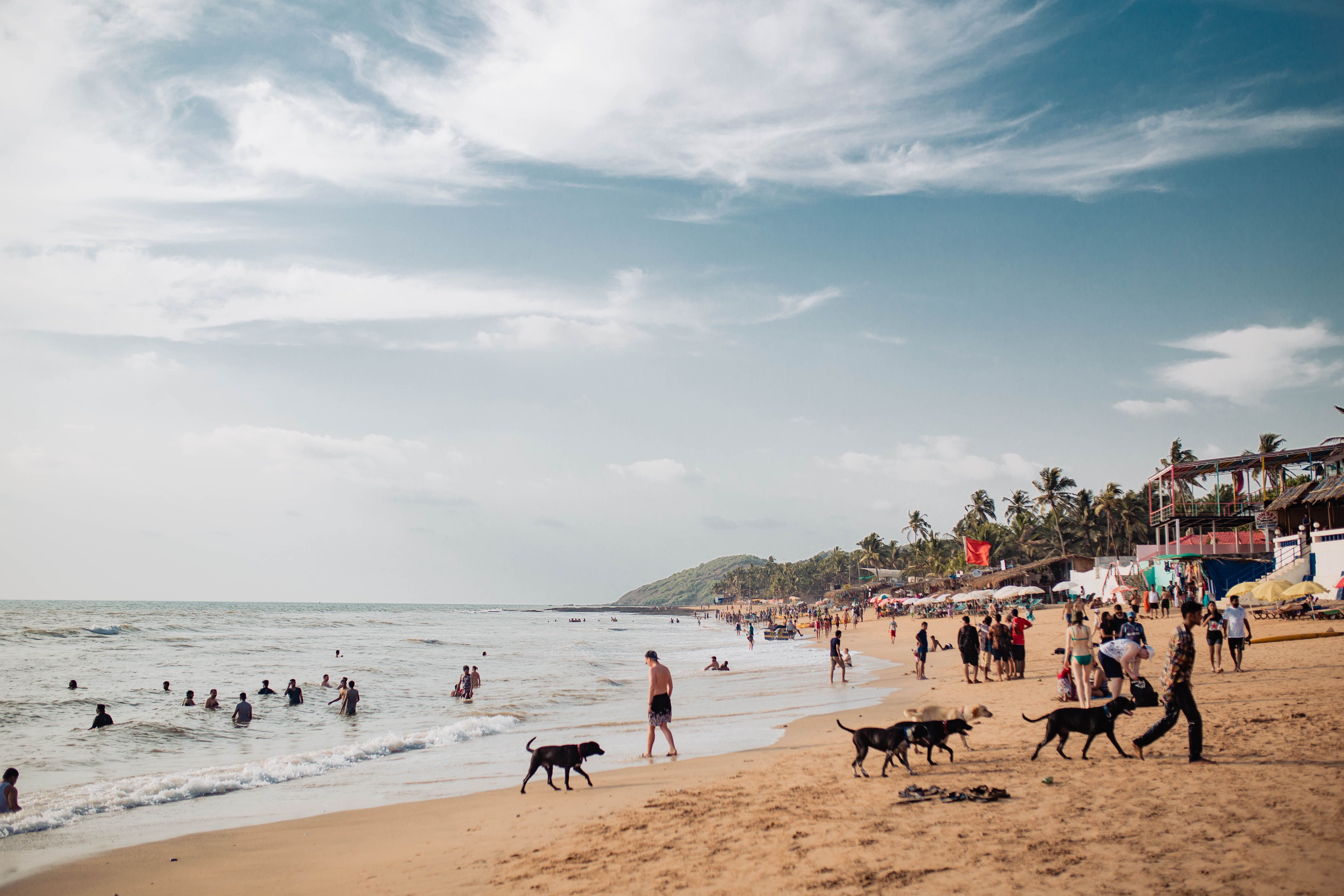 Bustling Baga Beach in Goa with visitors enjoying a sunny day
