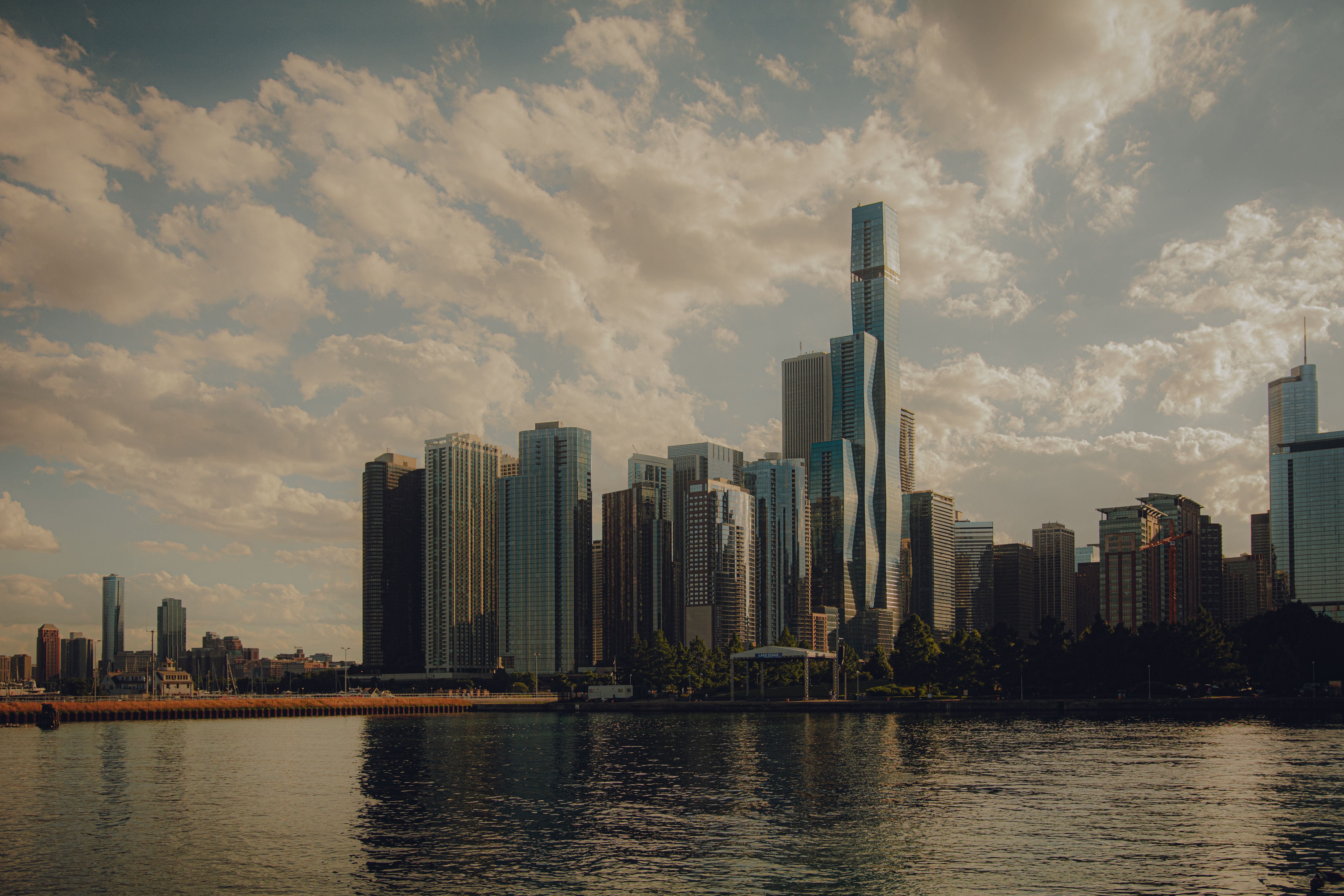 Chicago skyline across Lake Michigan under a dramatic sky